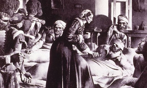 Un dibujo de grupo de enfermos en el suelo y mujeres atendiéndoles. 
Florence-Nightingale-0